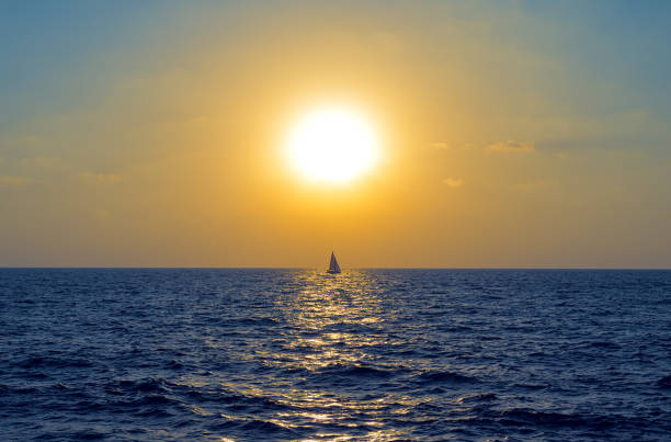 istock Sailboat in the rays of the setting sun 1413840607