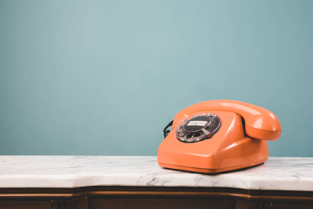 istock Close-up view of an old telephone on a table. 1413840634