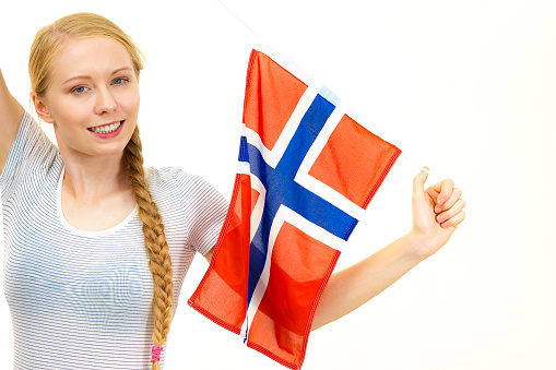 Blonde girl braid hair with norwegian flag. Scandinavian people.