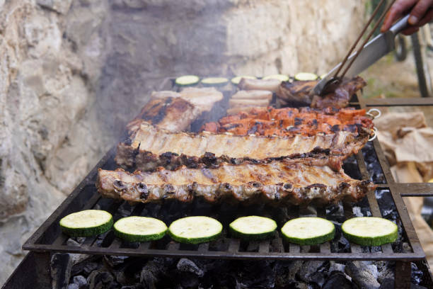 istock Grilled meat with vegetables and meat with smoke 1413841862