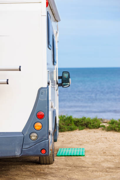 istock Camper on beach seashore. Holidays trip. 1413842164