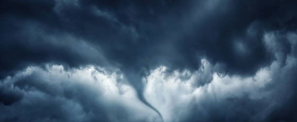 istock The typhoon is born, a tornado in a stormy dark sky with black clouds and a strong wind. Panoramic image. Concept on the theme of weather, natural disasters, tornadoes, typhoons, tornadoes, thunderstorm. 1413842176
