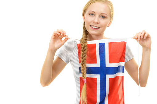 Blonde girl braid hair with norwegian flag. Scandinavian people.