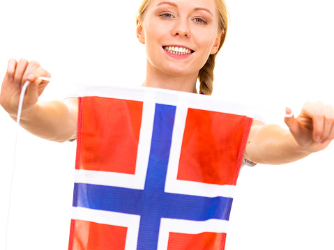 Blonde teenage girl holding flag of Norway. Education. Norwegian language school. Visit Norway concept.