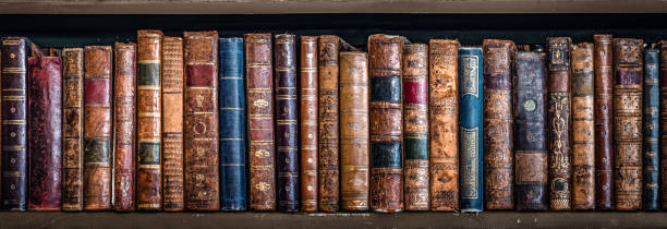 Old books on wooden shelf. Bookshelf history theme grunge background. Concept on the theme of history, nostalgia, old age. Retro style. stock photo