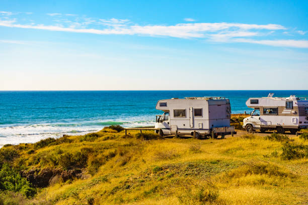 istock Camper rv camping on sea shore, Spain 1413843176