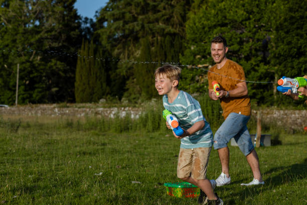 istock Water Gun Fun with Family 1413843392
