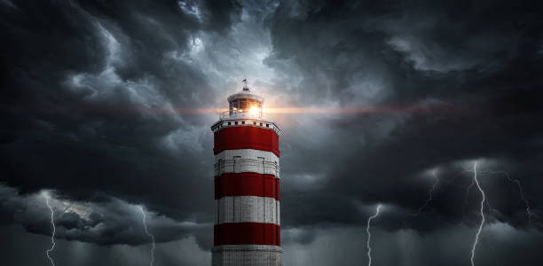 istock View on typhoon, hurricane, tornado, lighthouse and rain sky. Panoramic view of the stormy sky, lighthouse and dark clouds. Concept on the theme of weather, natural disasters,  tornadoes, typhoons. 1413845152