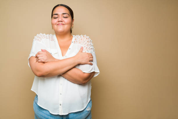 istock Lovely plus size woman embracing body positivity 1413845462