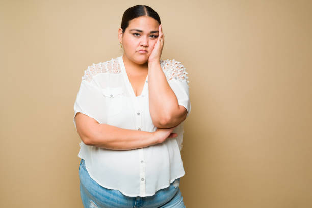 istock Bored obese young woman feeling tired 1413845467