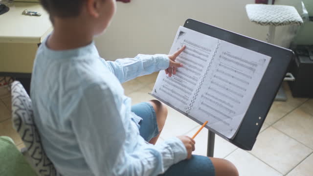 Solfege Practicing By Small Child In Music School