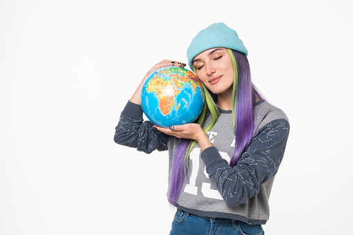 Cheerful caucasian eco-friendly young woman hipster embracing hugging globe, protecting against coronavirus pandemic pollution contamination isolated in white