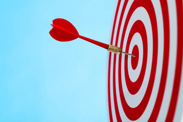 istock Dart arrow on center of dartboard 1413848617