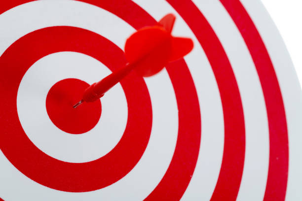 istock Dart arrow on center of dartboard 1413848620