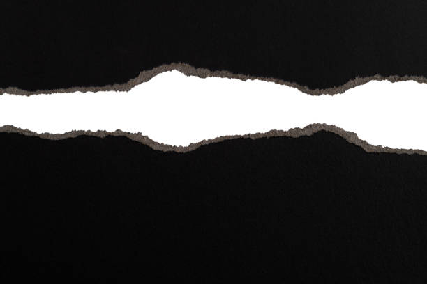 Background of torn black paper.