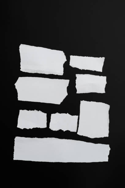 scraps of paper on black background - communication photography part of torn imagens e fotografias de stock
