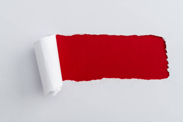 istock White paper tearing a hole 1413848787
