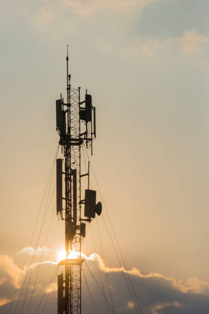 istock Telecommunication towers with colorful sky backgrounds at sunset 1413850342