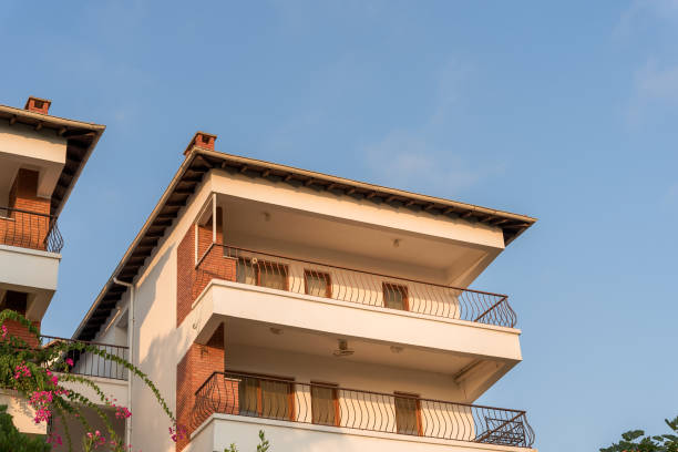 Southern turkish architecture with large balconies or terrace. Copy space. Blue sky.