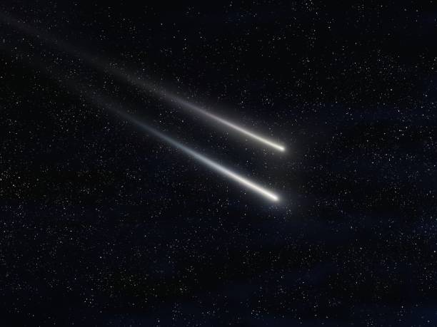 istock Two meteors in the night sky with stars 1413852621