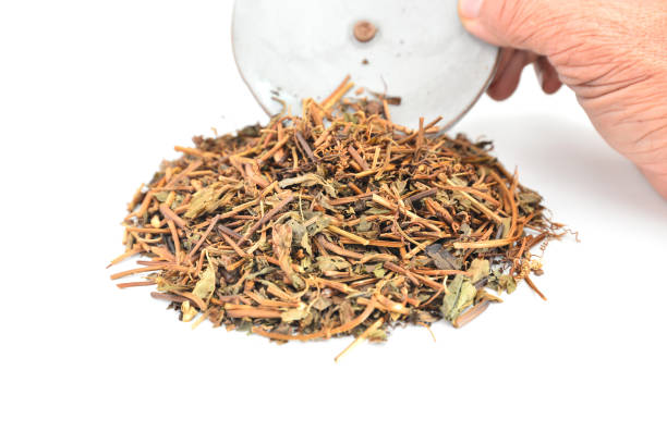 istock Dried tea leaves on a white background. 1413853178