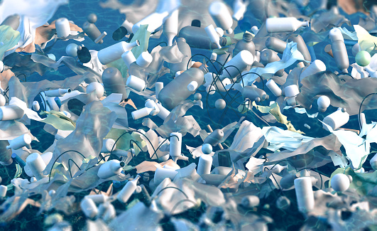 Conceptual image of a polluted environment with floating garbage: plenty of plastic bottles, bags, microspheres and generic waste floating in sea water. Abstract plastic pollution background. Digitally generated image.