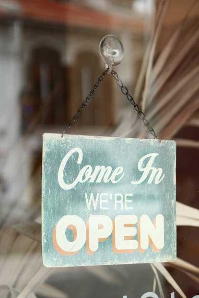 istock Open sign hanging front of cafe . 1413856678