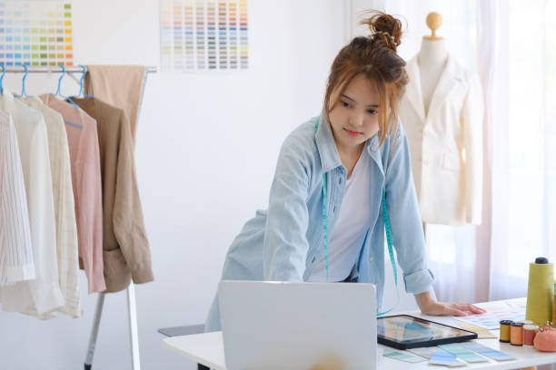 istock Fashion designer working in studio 1413858595
