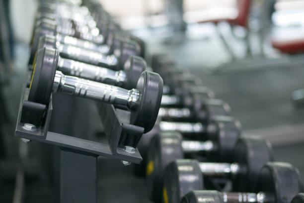 istock Dumbbell, barbell in the gym with copy space . 1413858908