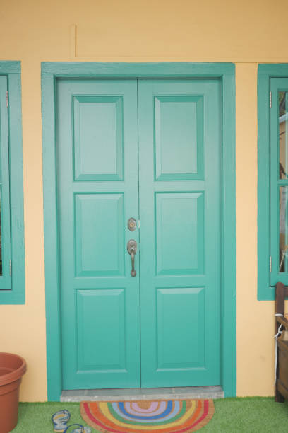 istock green color Front door in a singapore 1413859917