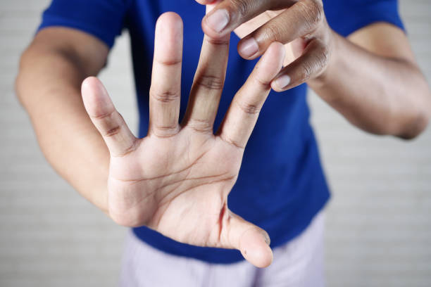 istock man suffering pain in hand close up 1413860129