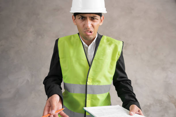 istock Arabic young architect inspector man using clipboard annoyed and frustrated shouting with anger, crazy and yelling, anger 1413860309