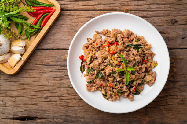 istock Stir-Fried Minced Pork with Basil on white plate 1413861521