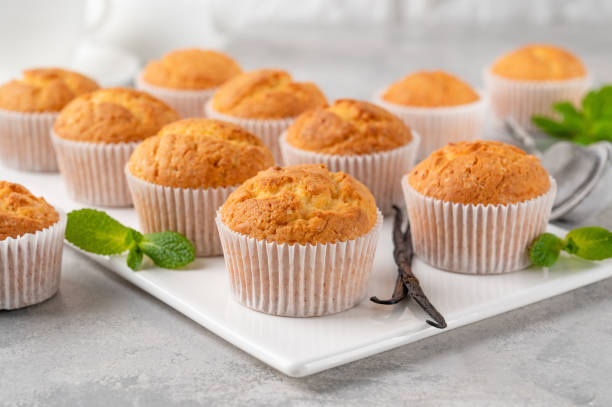 istock Fresh baked Vanilla cupcakes with mint, selective focus, copy space. 1413861625