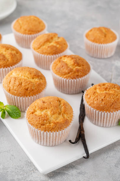 istock Fresh baked Vanilla cupcakes with mint, selective focus, copy space. 1413861626