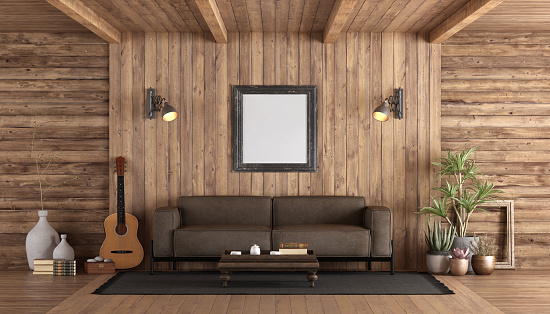Rustic style wooden living room with brown sofa, classic guitar and mockup poster - 3d rendering
Note:  room does not exist in reality, Property model is not necessary
