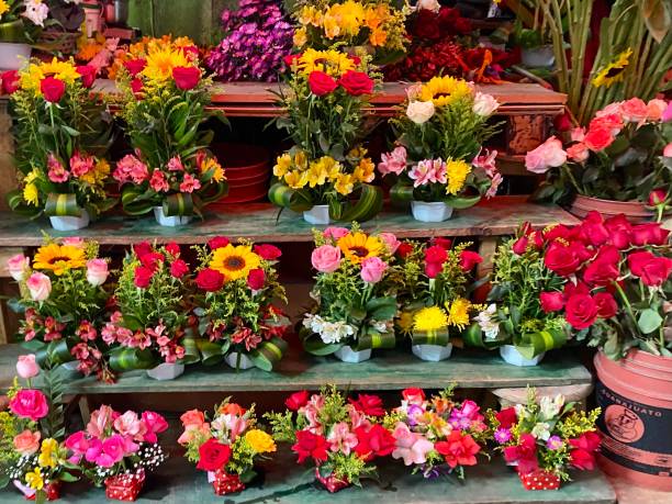 istock Colourful flowers in a market stall 1413865537
