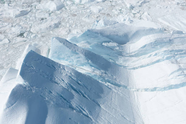 istock Climate change and global warming. Icebergs from a melting glacier in Greenland. 1413865552