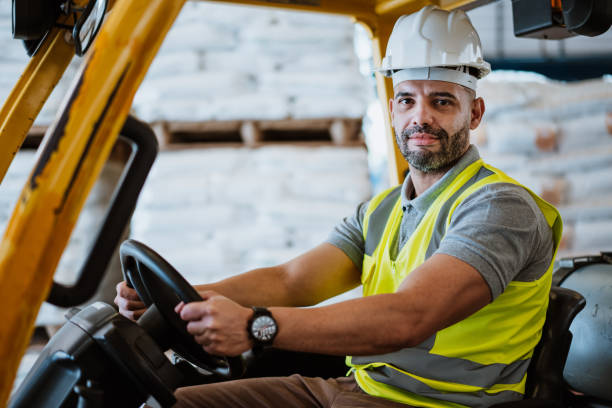 istock Employee on forklift in warehouse depot 1413866407