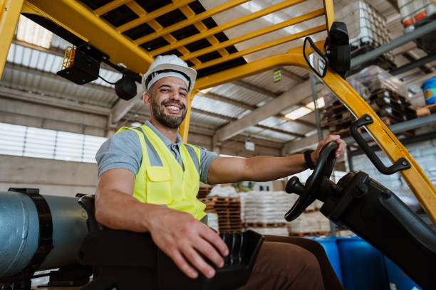 istock Employee on forklift in warehouse depot 1413866824