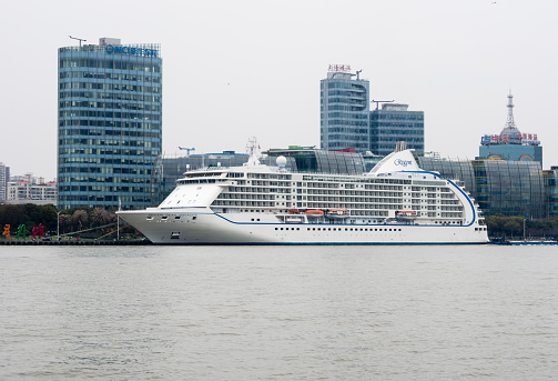 Shanghai, China - March 22, 2016: Seven Seas Voyager cruise liner on Huangpu river in central Shanghai