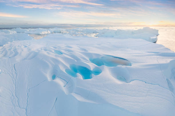 istock Climate change and global warming. Icebergs from a melting glacier in Greenland. 1413867272