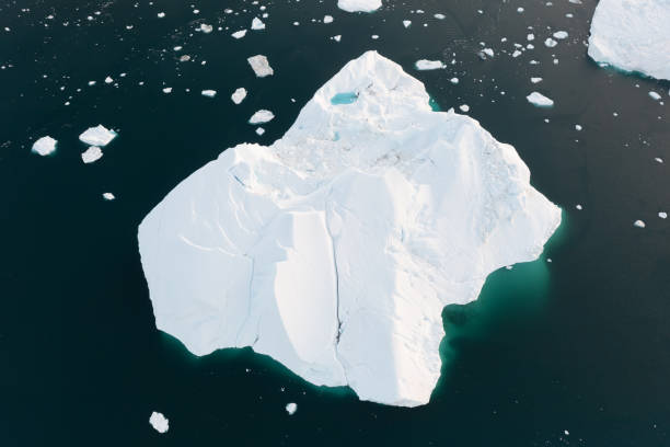 istock Climate change and global warming. Icebergs from a melting glacier in Greenland. 1413867400