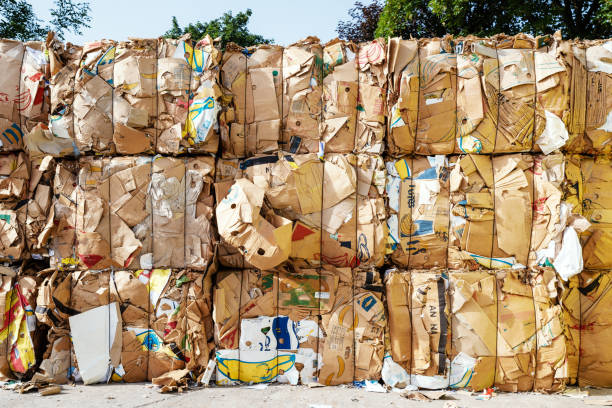 istock stack of old waste paper in front of a recycling facility 1413869194
