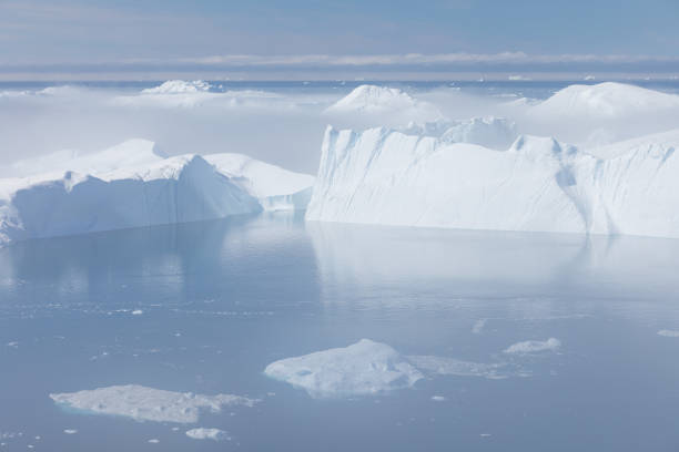 istock Climate change and global warming. Icebergs from a melting glacier in Greenland. 1413869204