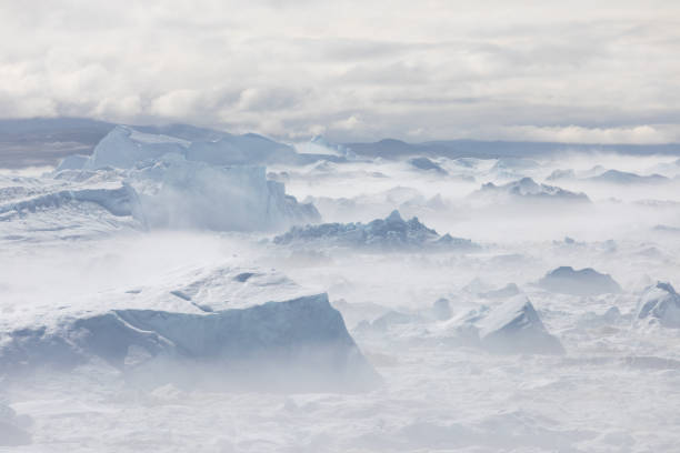 istock Climate change and global warming. Icebergs from a melting glacier in Greenland. 1413869687