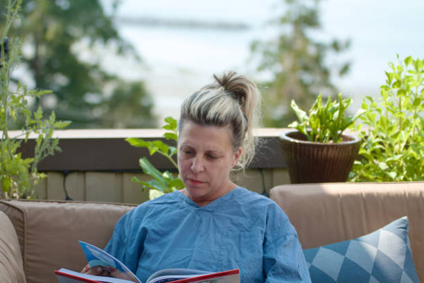 istock Woman with Scrubs reading recipe book 1413869728