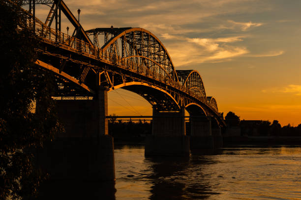 istock Maria Valeria Bridge from the riverbank at sunset 1413870751