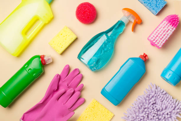 istock Many different house cleaning products on color background, top view 1413872620