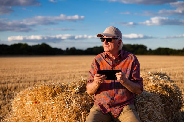 istock Farmers working on the land and checking crops 1413873449
